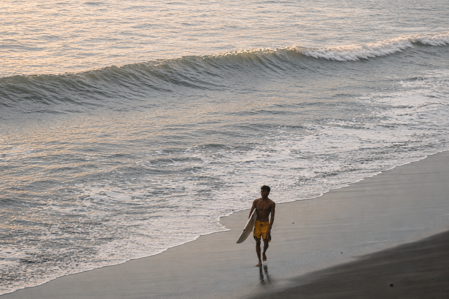 Beach walk with surfboard